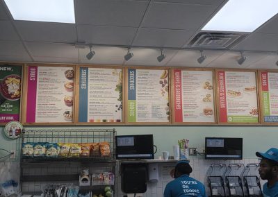 Tropical Smoothie Cafe menu on wall