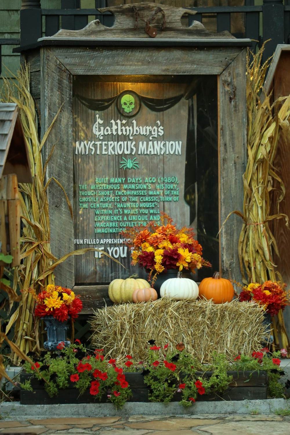 Mysterious Mansion sign surrounded by pumpkins in Gatlinburg